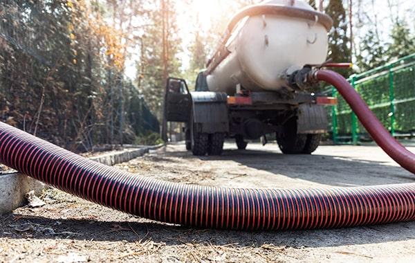 during grease interceptor pumping, a vacuum truck removes the accumulated grease and wastewater from the interceptor